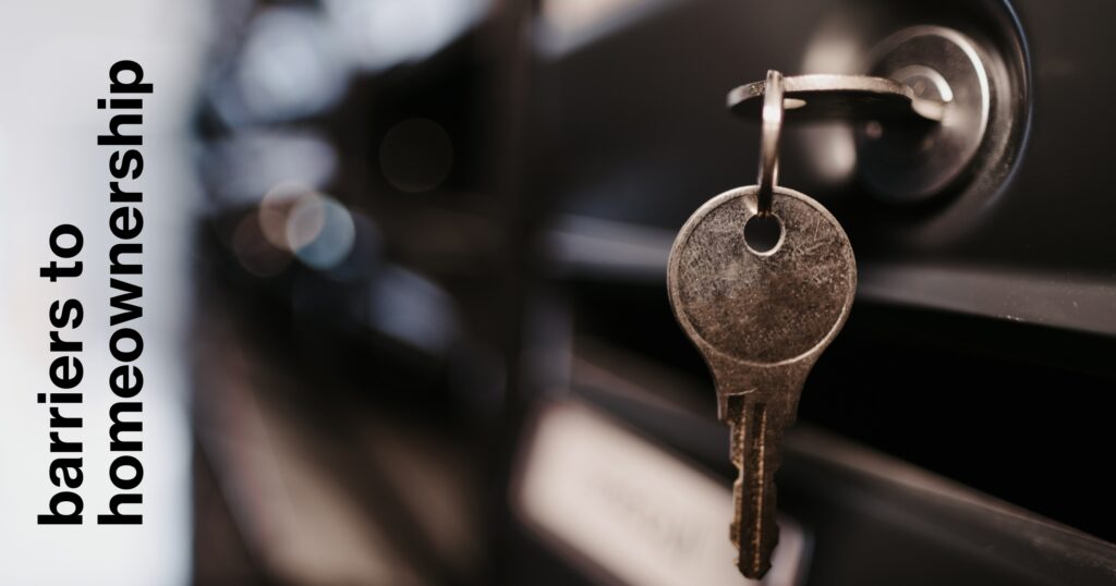 Key hangs in door lock with the title "Barriers to Homeownership" on the left.