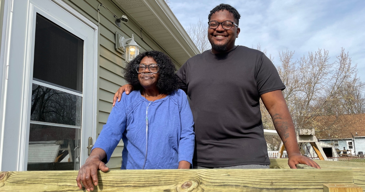 Mattie and De'Angelo smile for a picture on her new ramp.