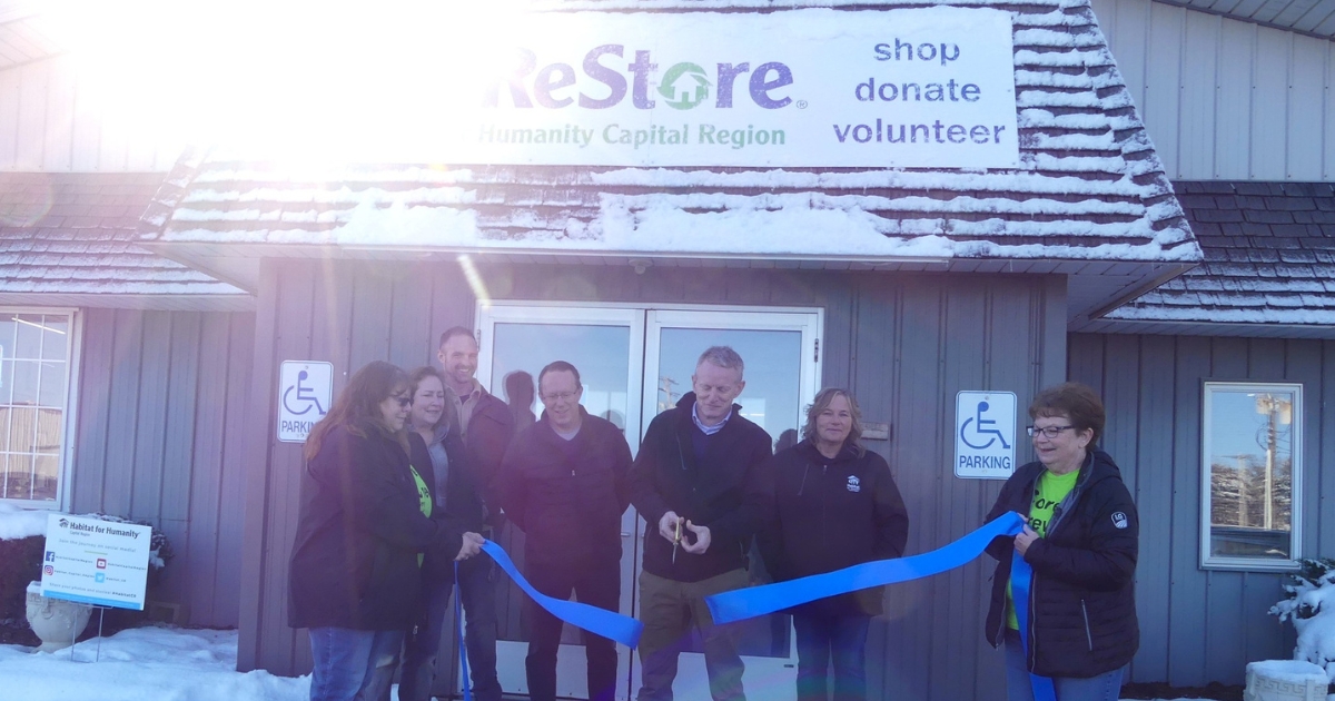 Brent Taylor cuts the ribbon, officially reopening the St. Johns ReStore!