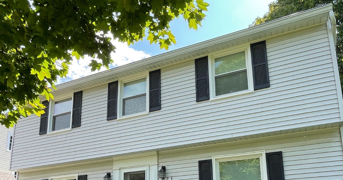 Katie's Home Repair: A view of Katie's home on a warm summer day.